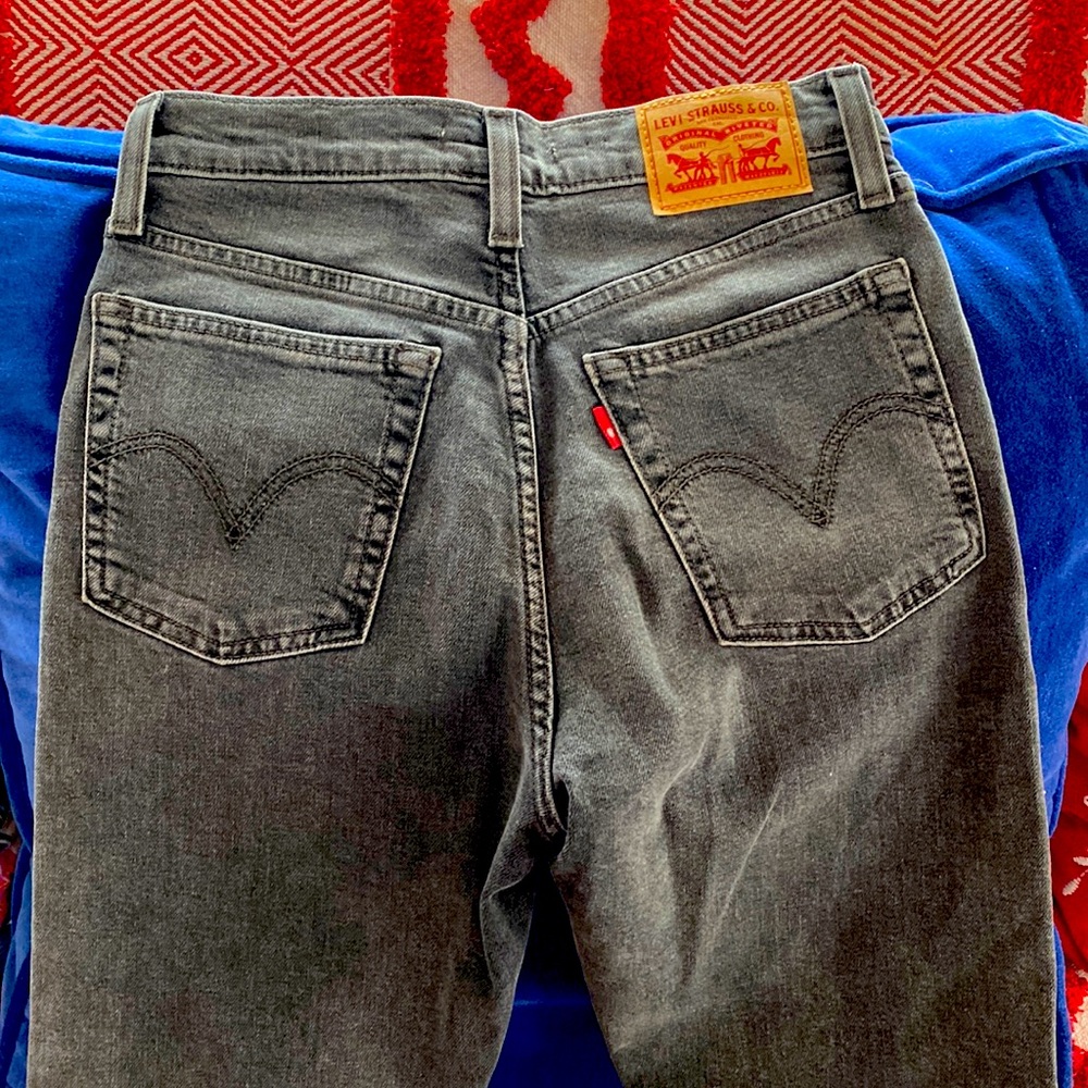 These are never-worn, no tag, Levi faded gray Wedgie Skinnies, size 25.